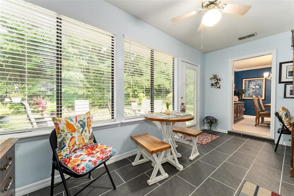 10922 Palmetto Boulevard Alachua, FL 32615 - Photo 32 of 51 a living room filled with furniture and a large window