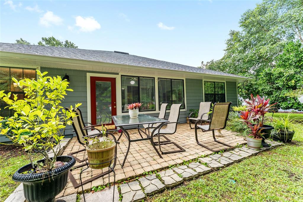 10922 Palmetto Boulevard Alachua, FL 32615 - Photo 36 of 51 a view of a chairs and table in a patio