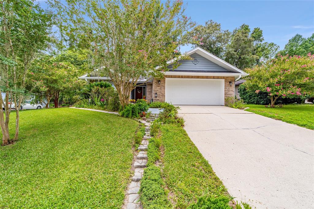10922 Palmetto Boulevard Alachua, FL 32615 - Photo 41 of 51 a front view of a house with yard