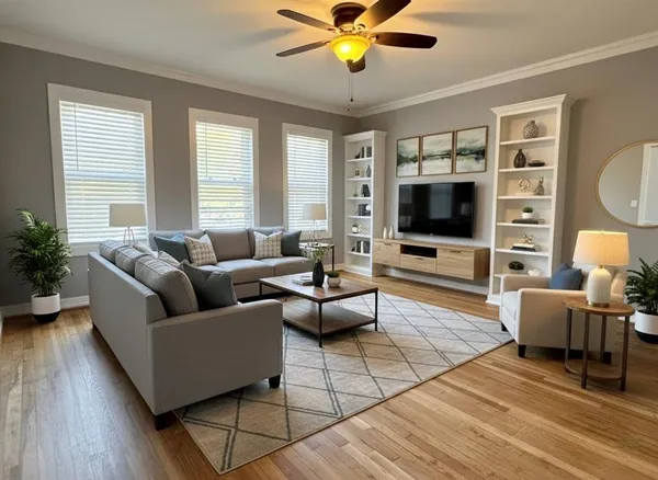 a living room with furniture flat screen tv and window