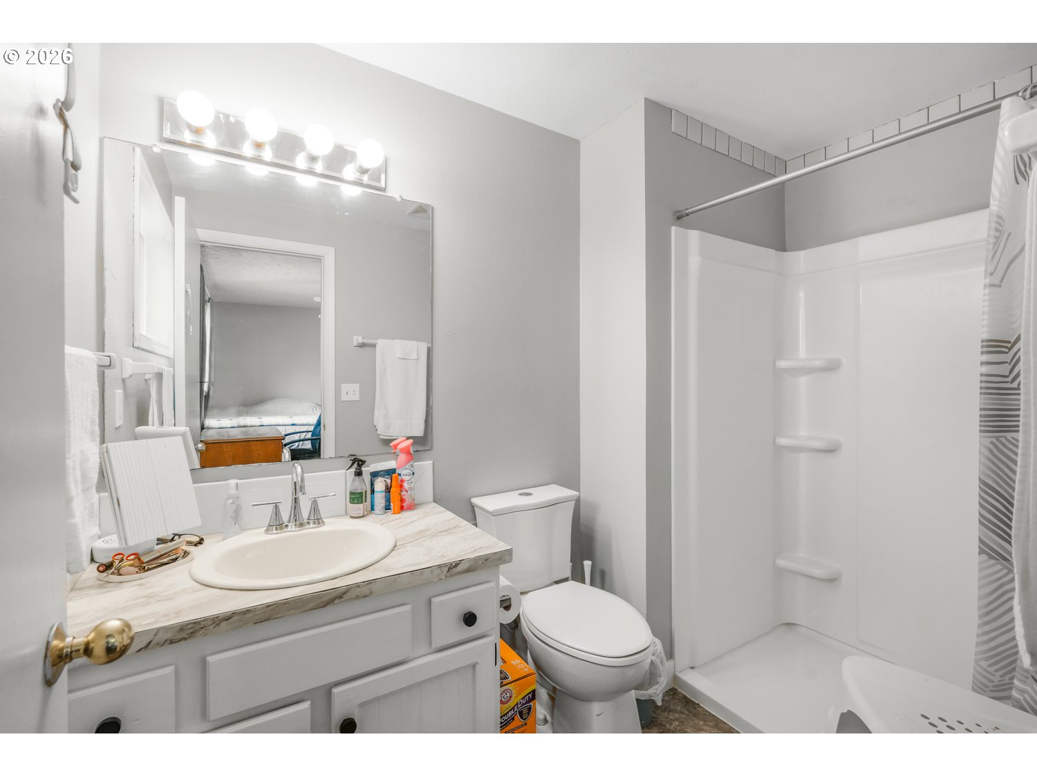 1829 Southwest 17th Street Gresham, OR 97080 - Photo 13 of 27 a bathroom with a sink toilet vanity and shower