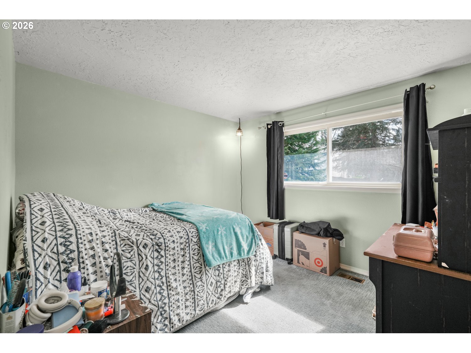 1829 Southwest 17th Street Gresham, OR 97080 - Photo 15 of 27 a bedroom with a bed window and a flat tv screen