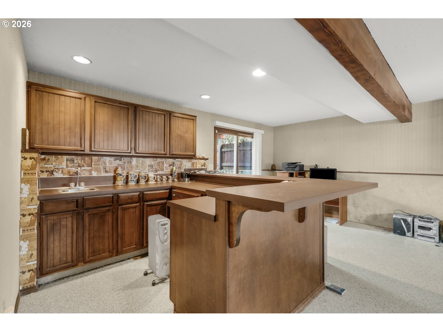1829 Southwest 17th Street Gresham, OR 97080 - Photo 20 of 27 a kitchen with kitchen island granite countertop a sink a counter top space and stainless steel appliances