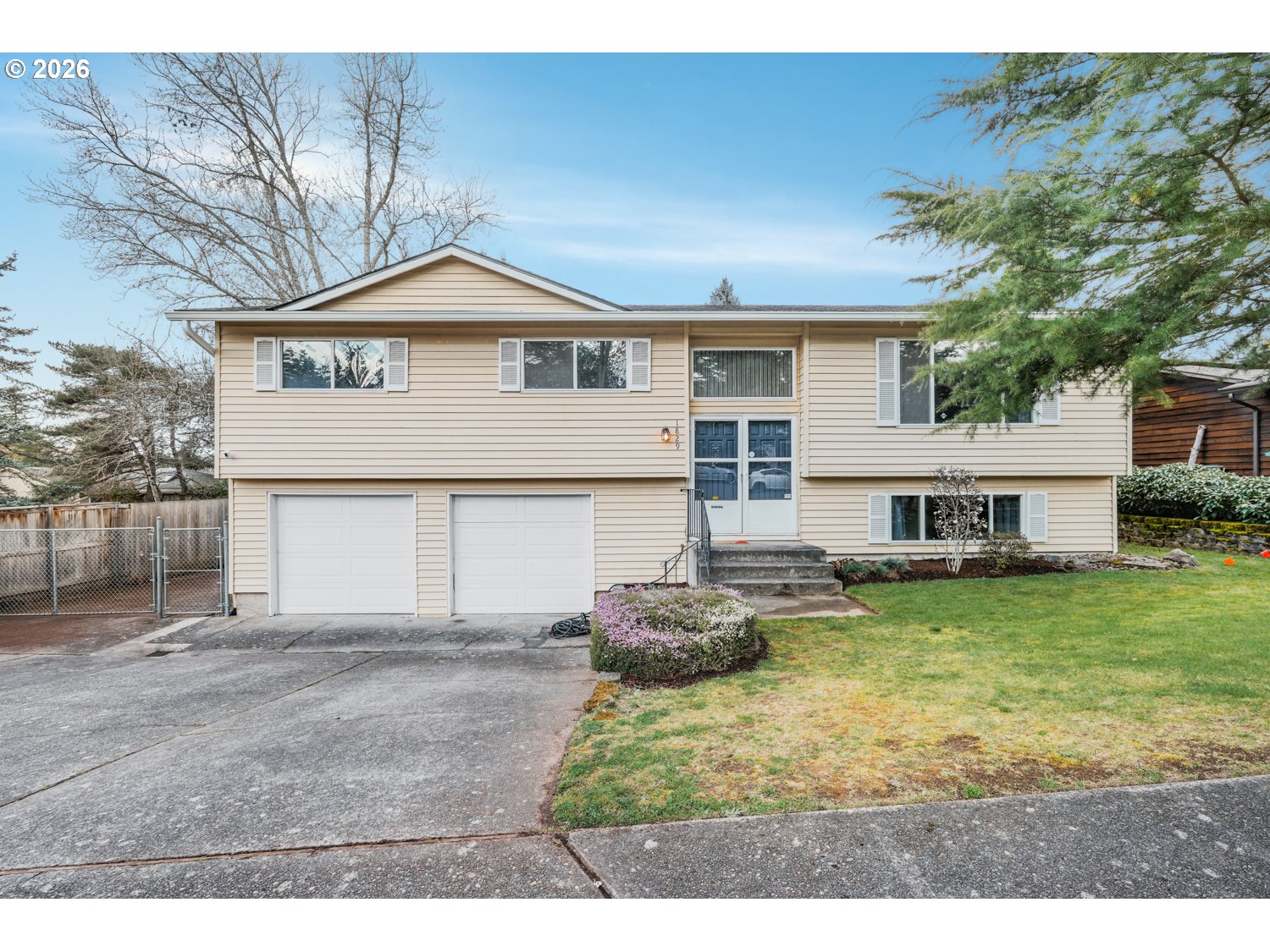 1829 Southwest 17th Street Gresham, OR 97080 - Photo 27 of 27 a view of a house next to a big yard and large trees