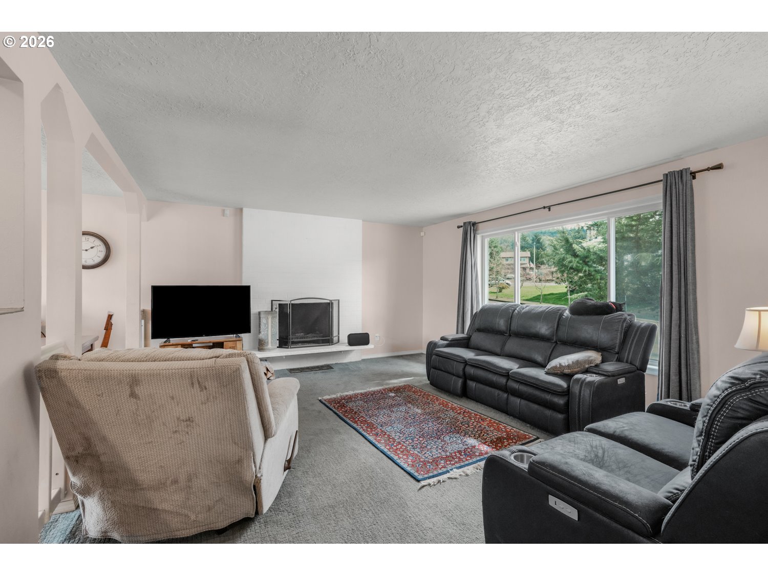 1829 Southwest 17th Street Gresham, OR 97080 - Photo 3 of 27 a living room with furniture and a flat screen tv