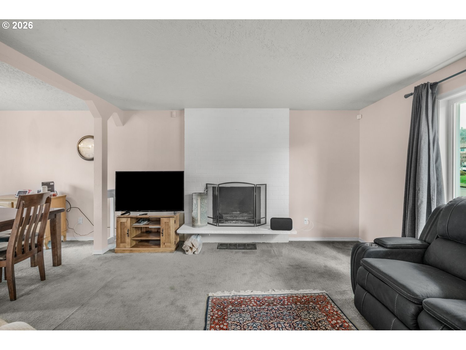 1829 Southwest 17th Street Gresham, OR 97080 - Photo 5 of 27 a living room with furniture and a flat screen tv