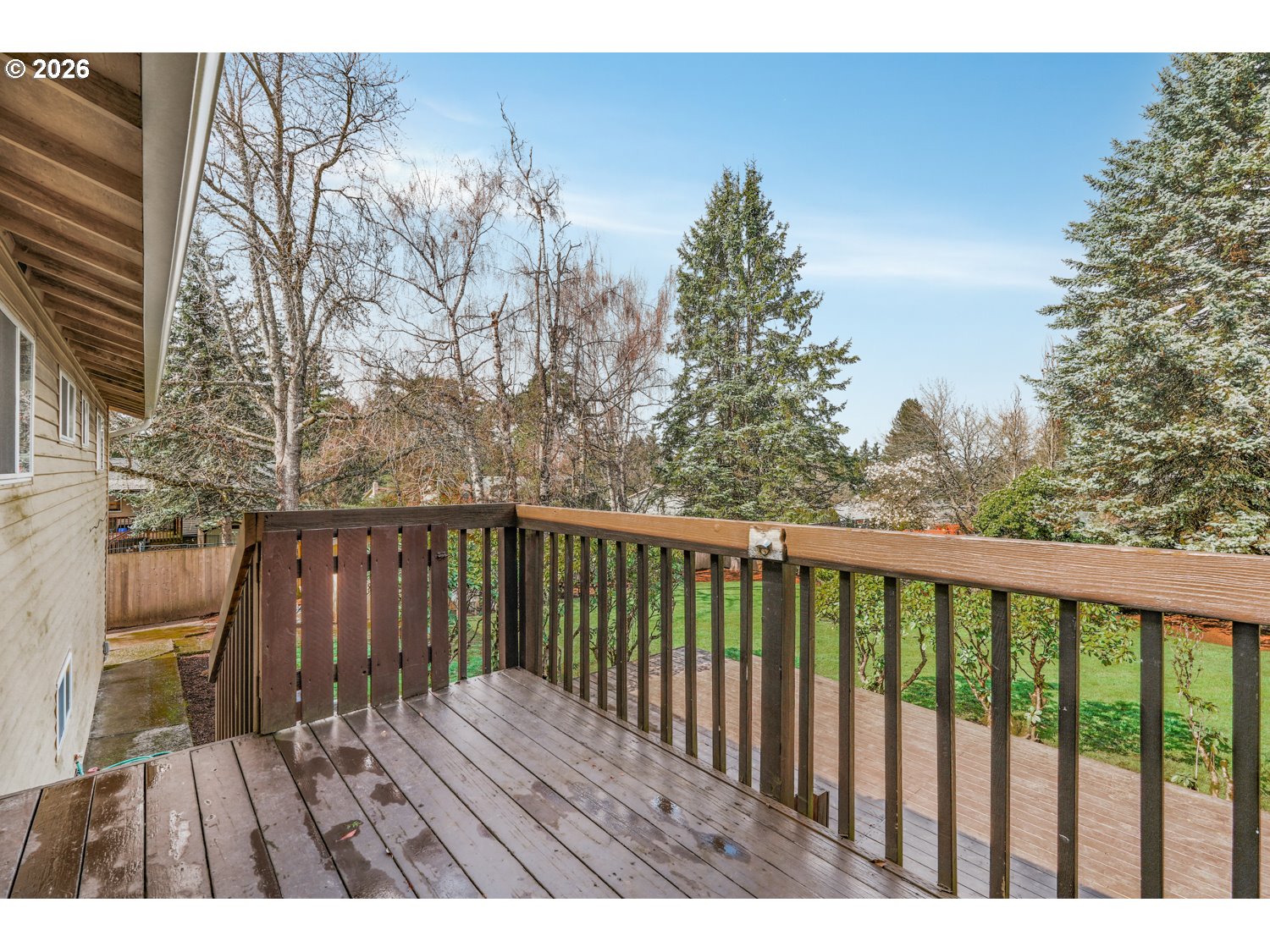 1829 Southwest 17th Street Gresham, OR 97080 - Photo 7 of 27 a view of balcony with wooden floor and fence