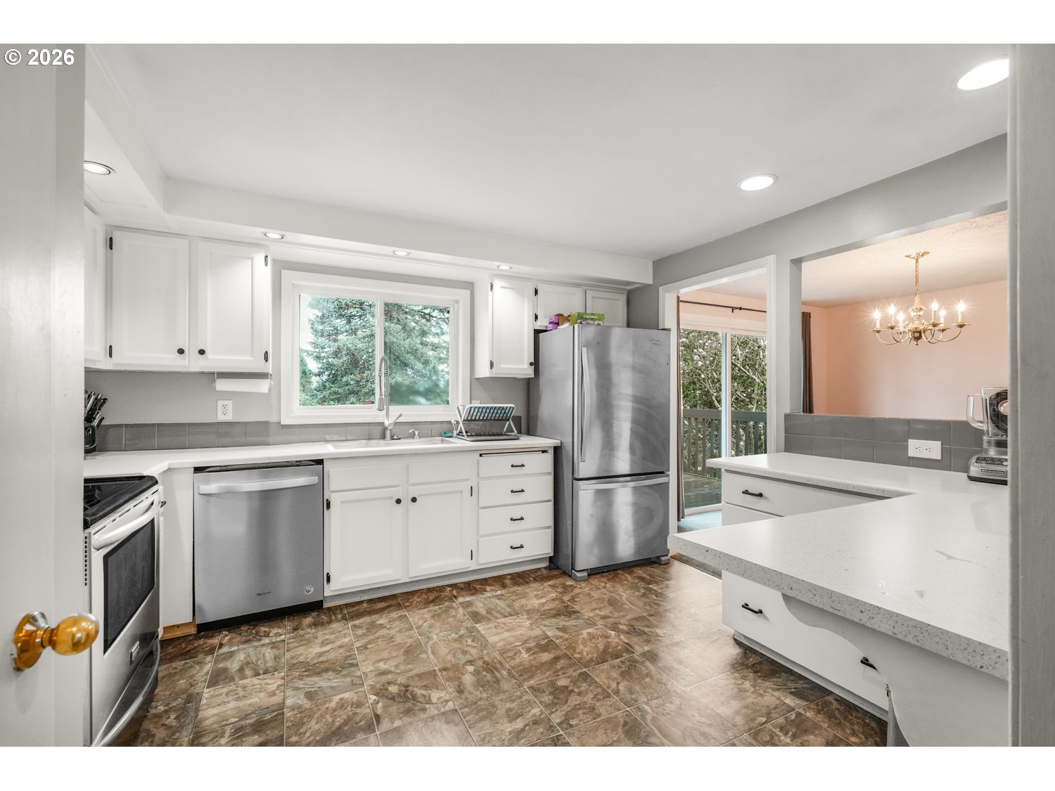 1829 Southwest 17th Street Gresham, OR 97080 - Photo 10 of 27 a kitchen with a refrigerator and a sink
