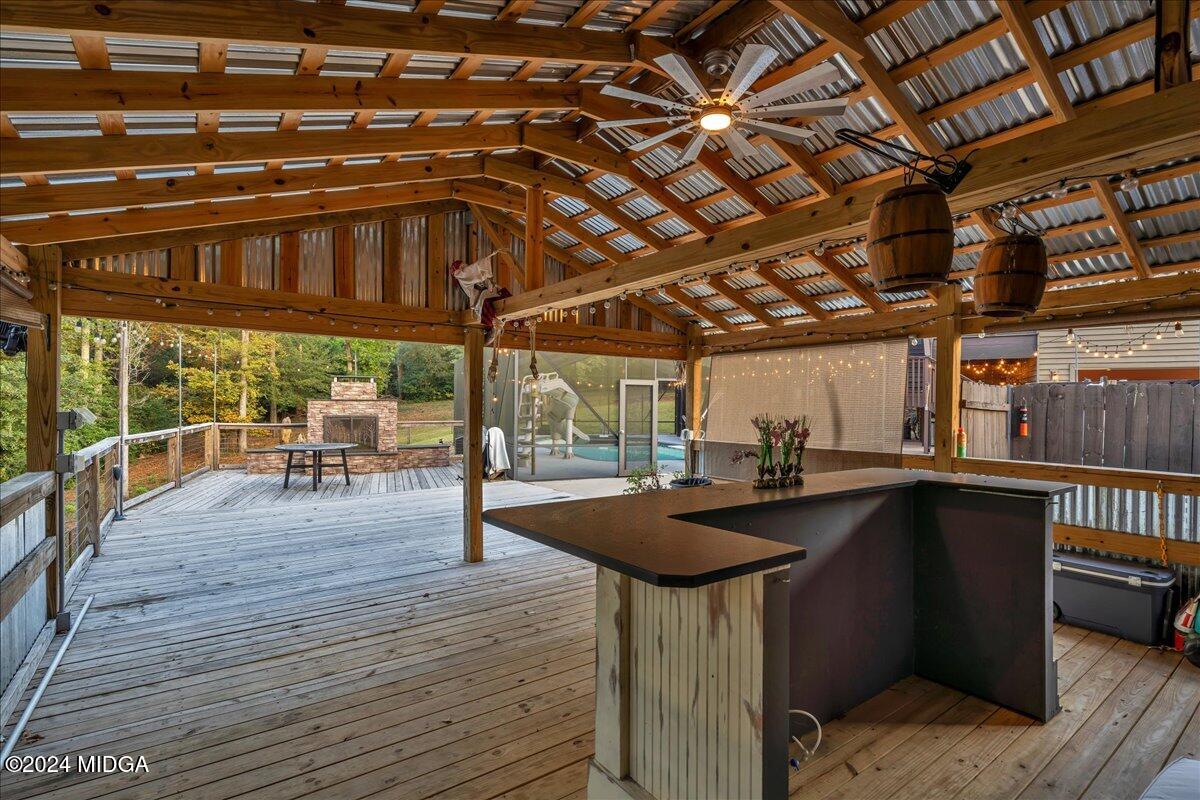 306 Thomson Street Centerville, GA 31028 - Photo 16 of 99 a view of a patio with table and chairs