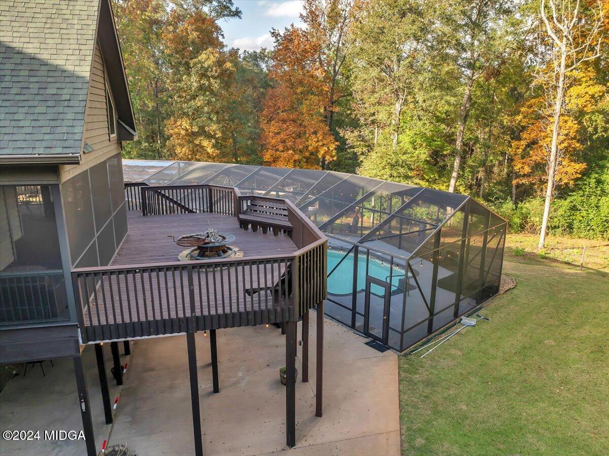 306 Thomson Street Centerville, GA 31028 - Photo 68 of 99 a view of a roof deck with wooden floor and fence