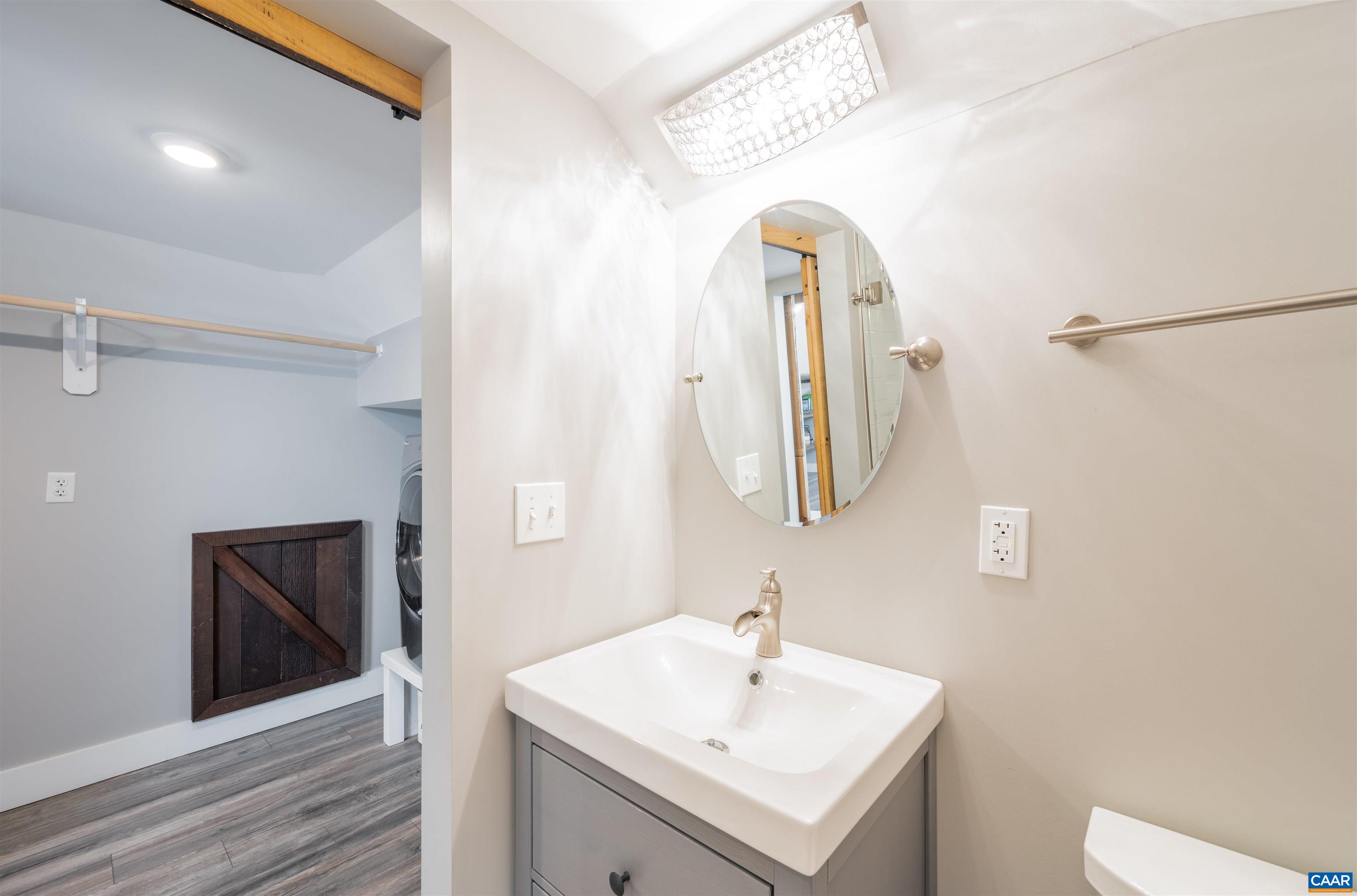 2600 Bennington Road Charlottesville, VA 22901 - Photo 36 of 60 a bathroom with a sink a toilet and mirror