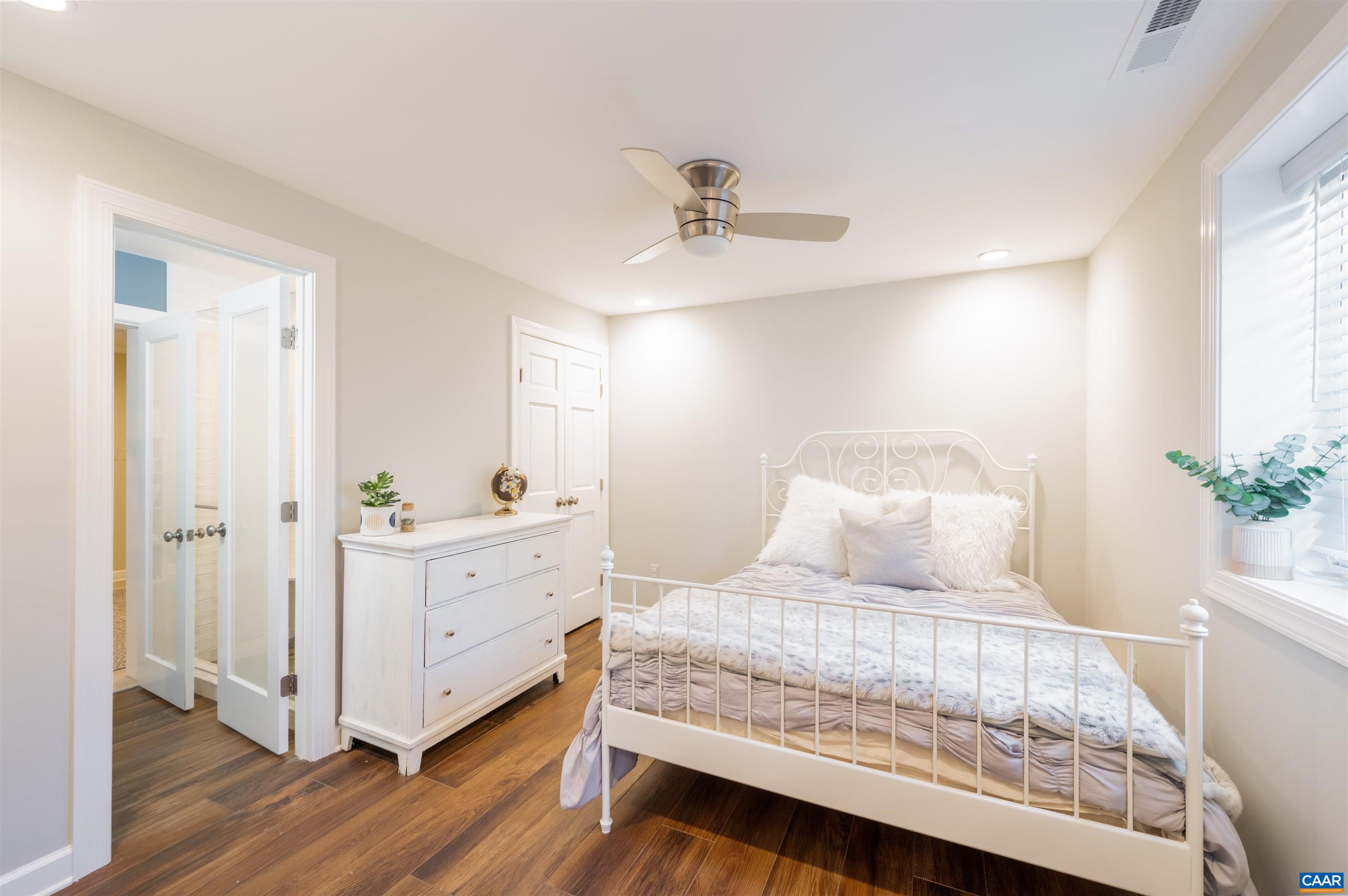 2600 Bennington Road Charlottesville, VA 22901 - Photo 41 of 60 a bedroom with a bed and a potted plant