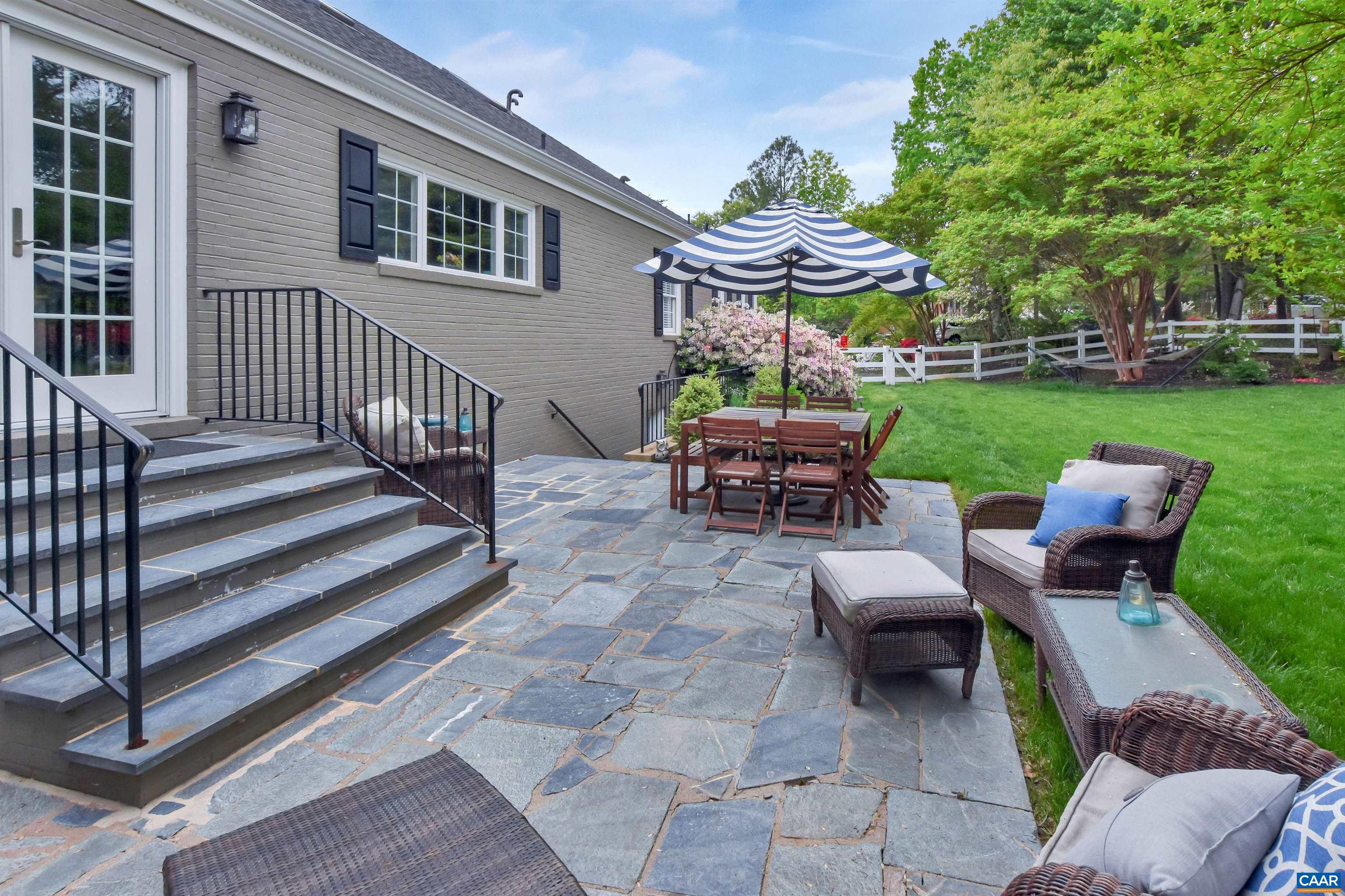 2600 Bennington Road Charlottesville, VA 22901 - Photo 53 of 60 a view of a patio with a table chairs and a yard