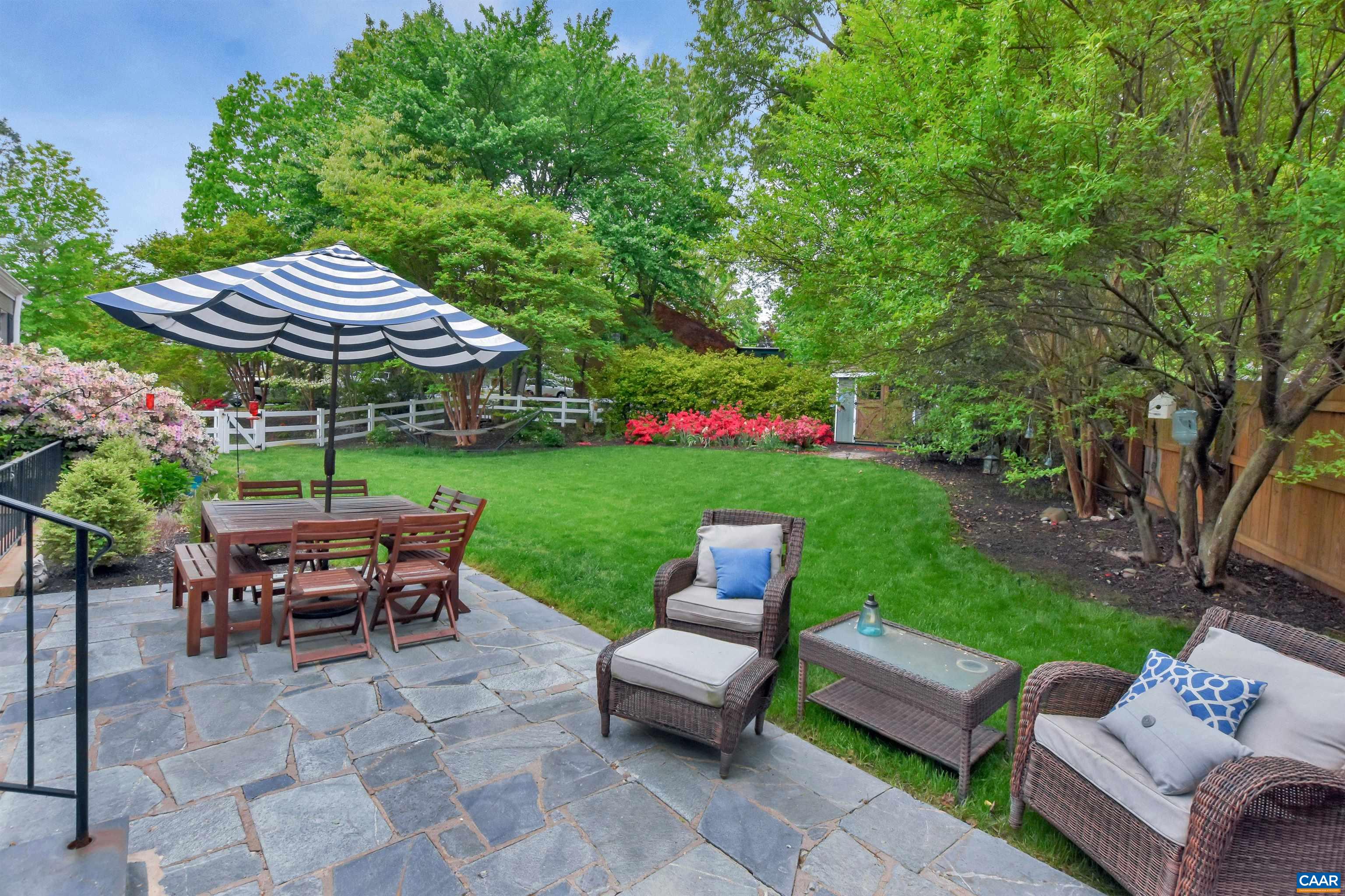 2600 Bennington Road Charlottesville, VA 22901 - Photo 54 of 60 a view of a table and chairs in backyard of the house