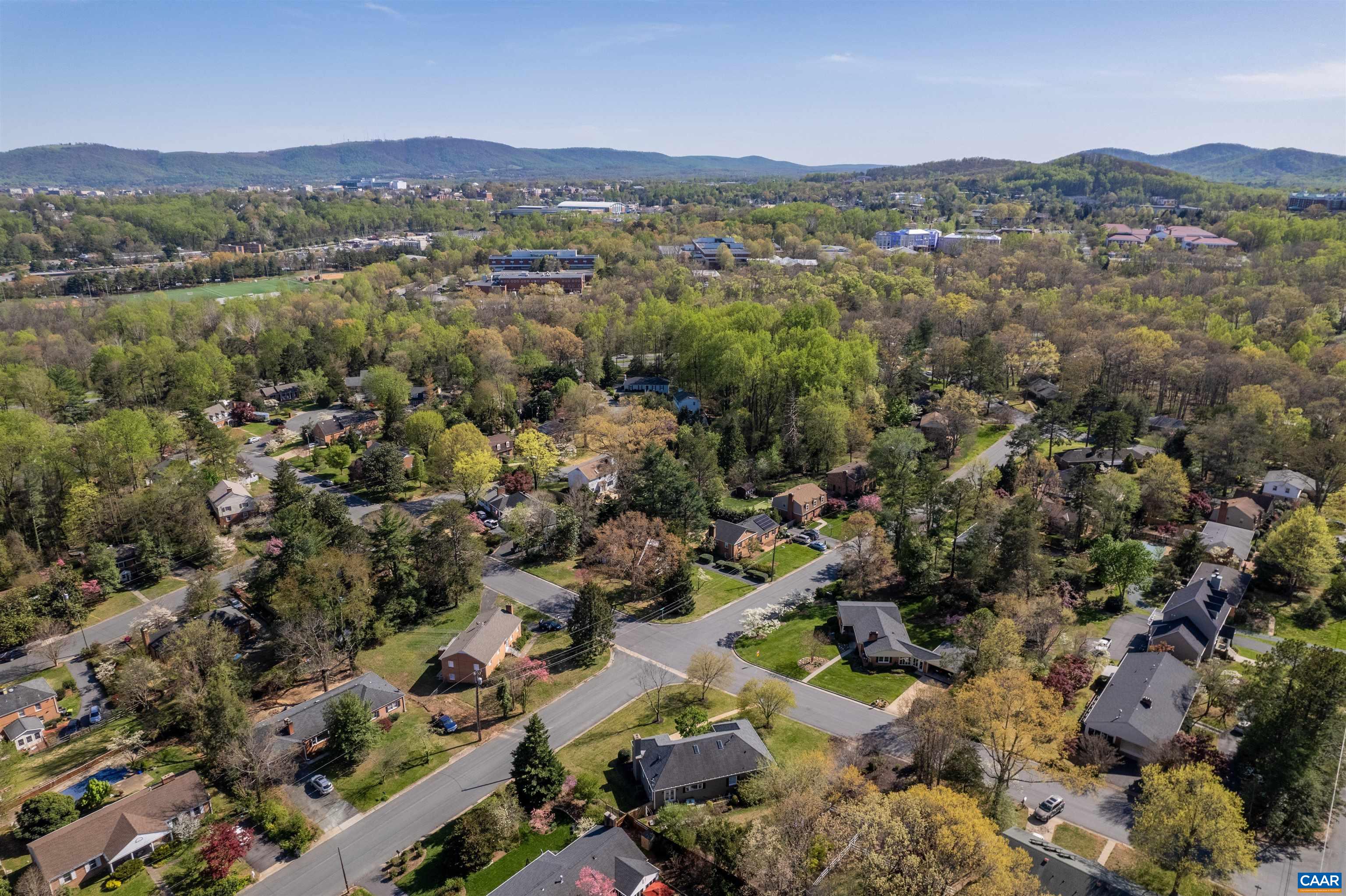 2600 Bennington Road Charlottesville, VA 22901 - Photo 60 of 60 an aerial view of a city with lots of residential buildings and mountain view in back
