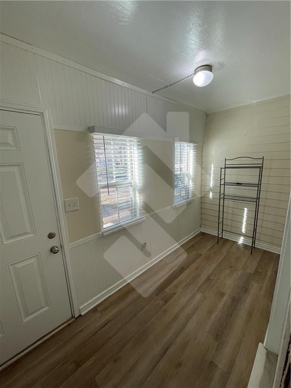 4267 Grogan Street Acworth, GA 30101 - Photo 16 of 37 an empty room with wooden floor and windows