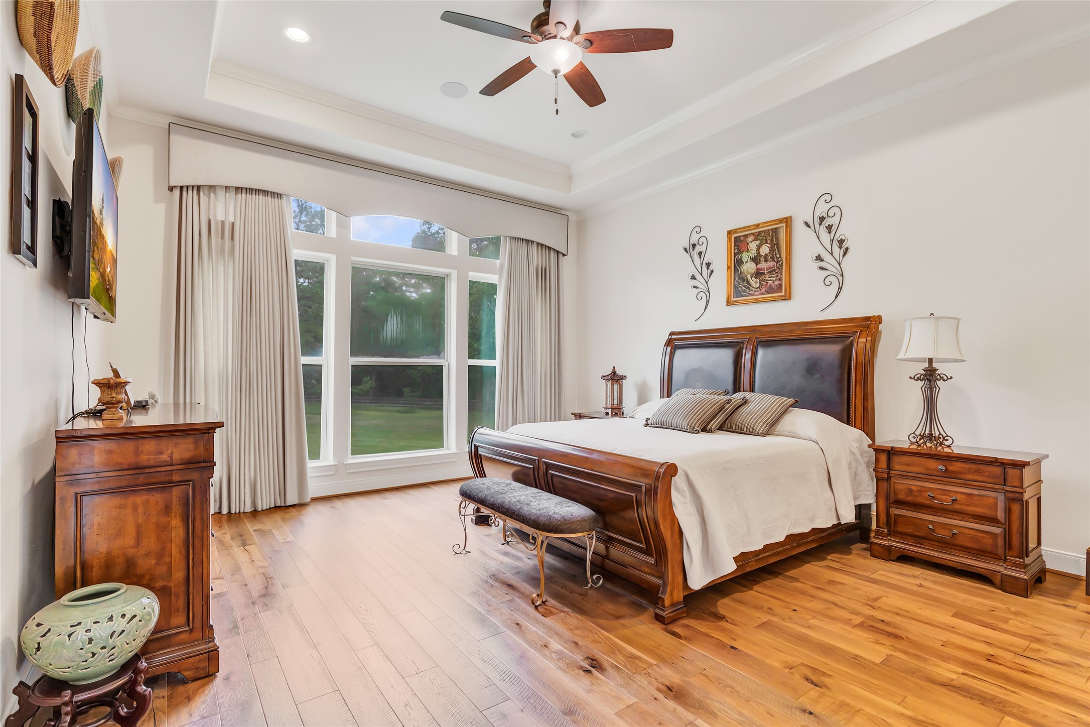 229 Sundog Road Huntsville, TX 77340 - Photo 34 of 50 This home features a spacious Primary Bedroom with a wall of windows overlooking the large back yard.