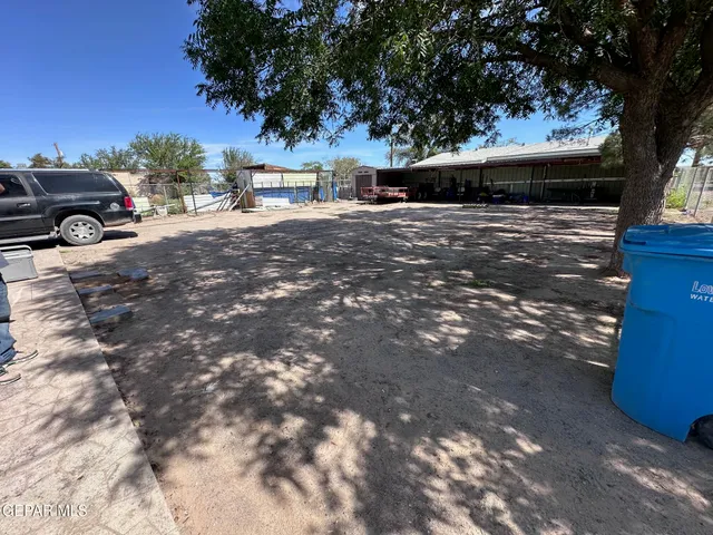a view of a car park in front of house