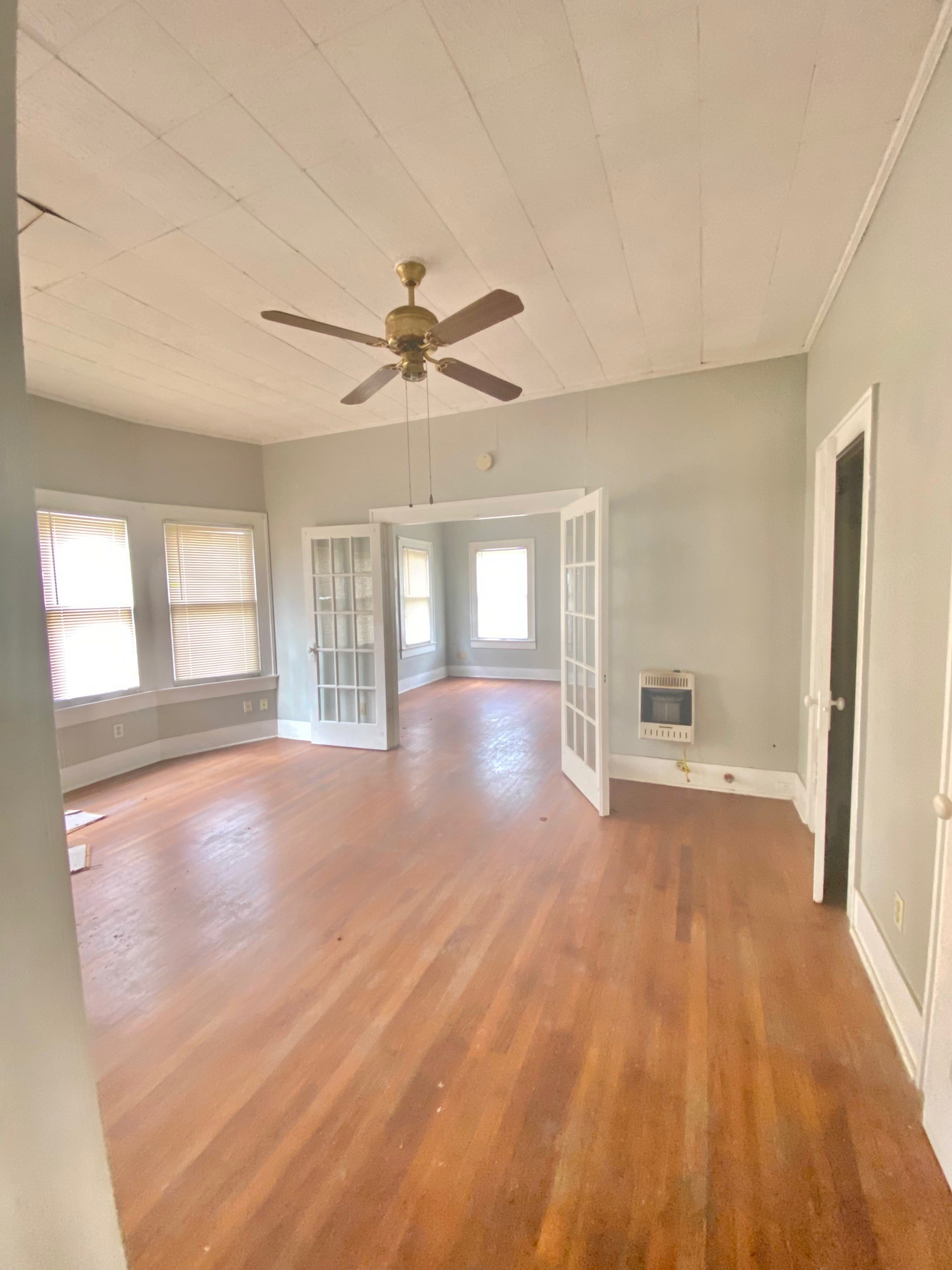 3310 Morrison Street Houston, TX 77009 - Photo 4 of 18 a view of an empty room with wooden floor and a window