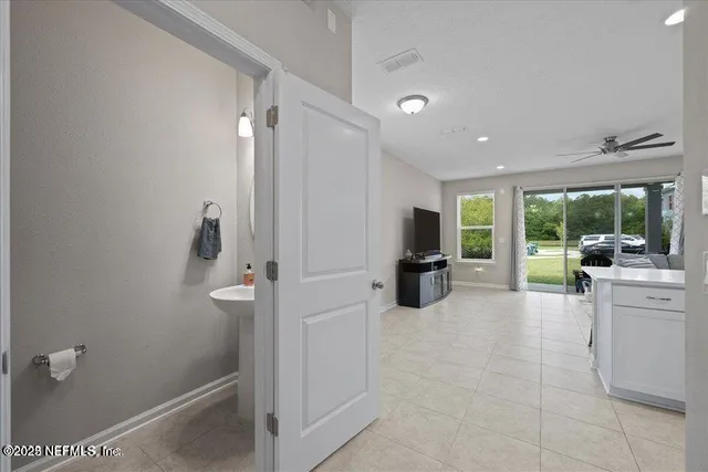 a large en suite bathroom with a tub and mirror