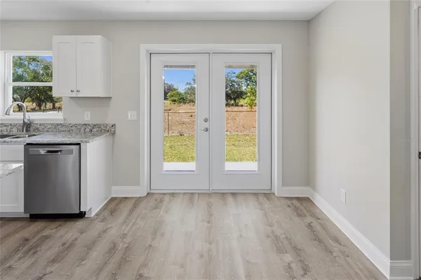 a view of kitchen and wooden floor