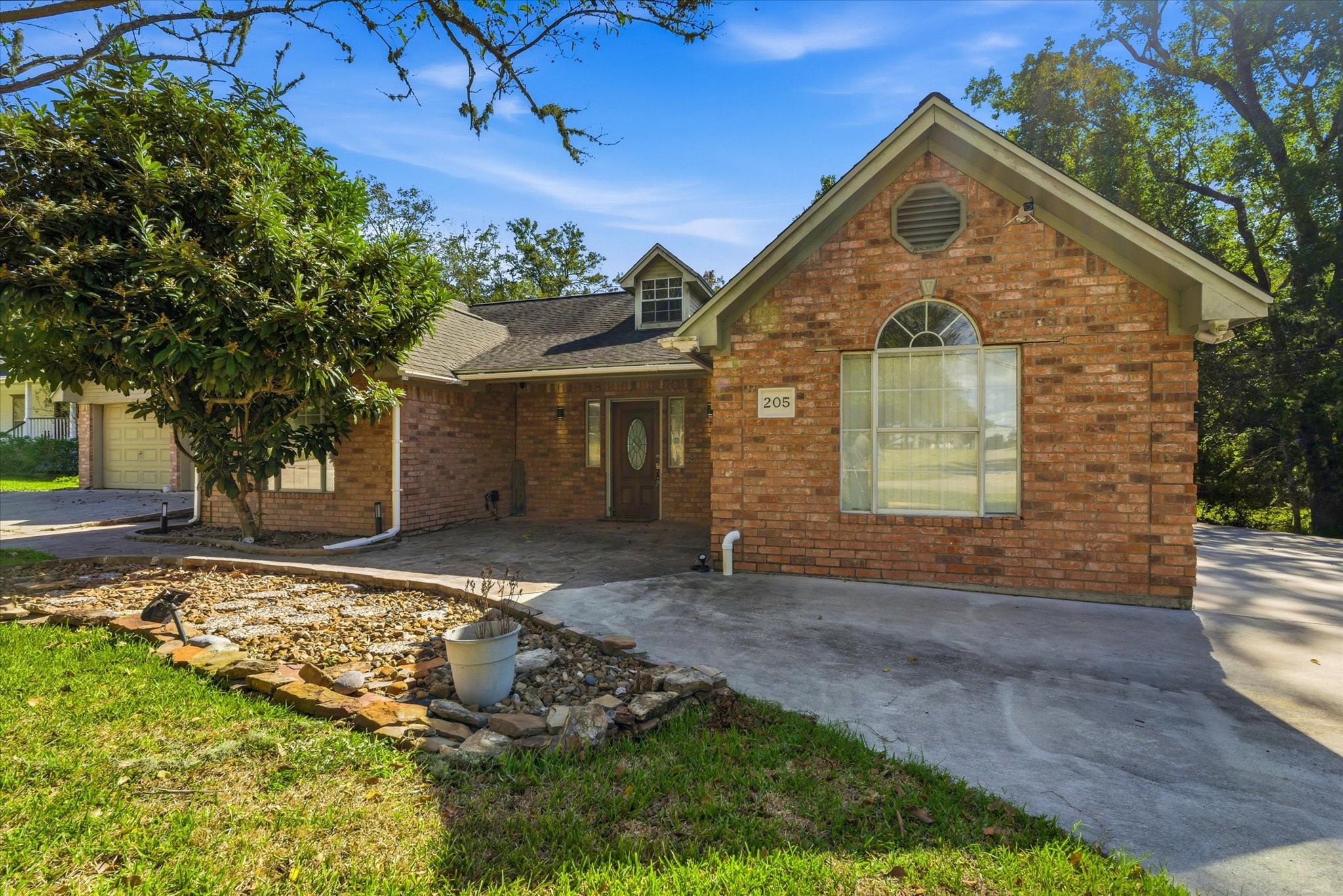 205 Don Q Baytown, TX 77523 - Photo 2 of 27 a front view of a house with a yard