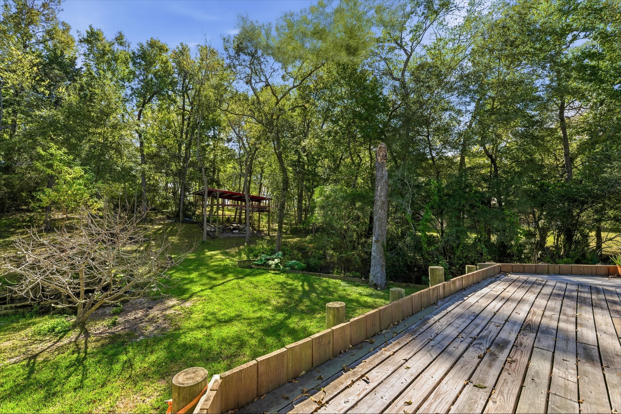 205 Don Q Baytown, TX 77523 - Photo 22 of 27 a view of balcony with wooden floor