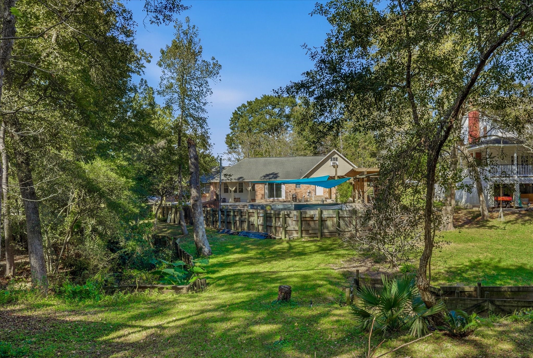 205 Don Q Baytown, TX 77523 - Photo 24 of 27 a view of a house with a big yard