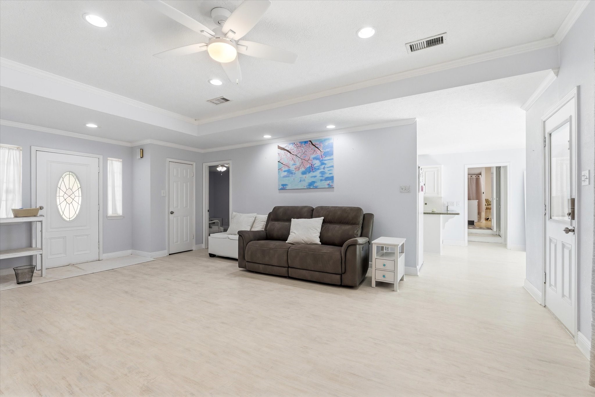 205 Don Q Baytown, TX 77523 - Photo 4 of 27 a living room with furniture a large window and a chandelier