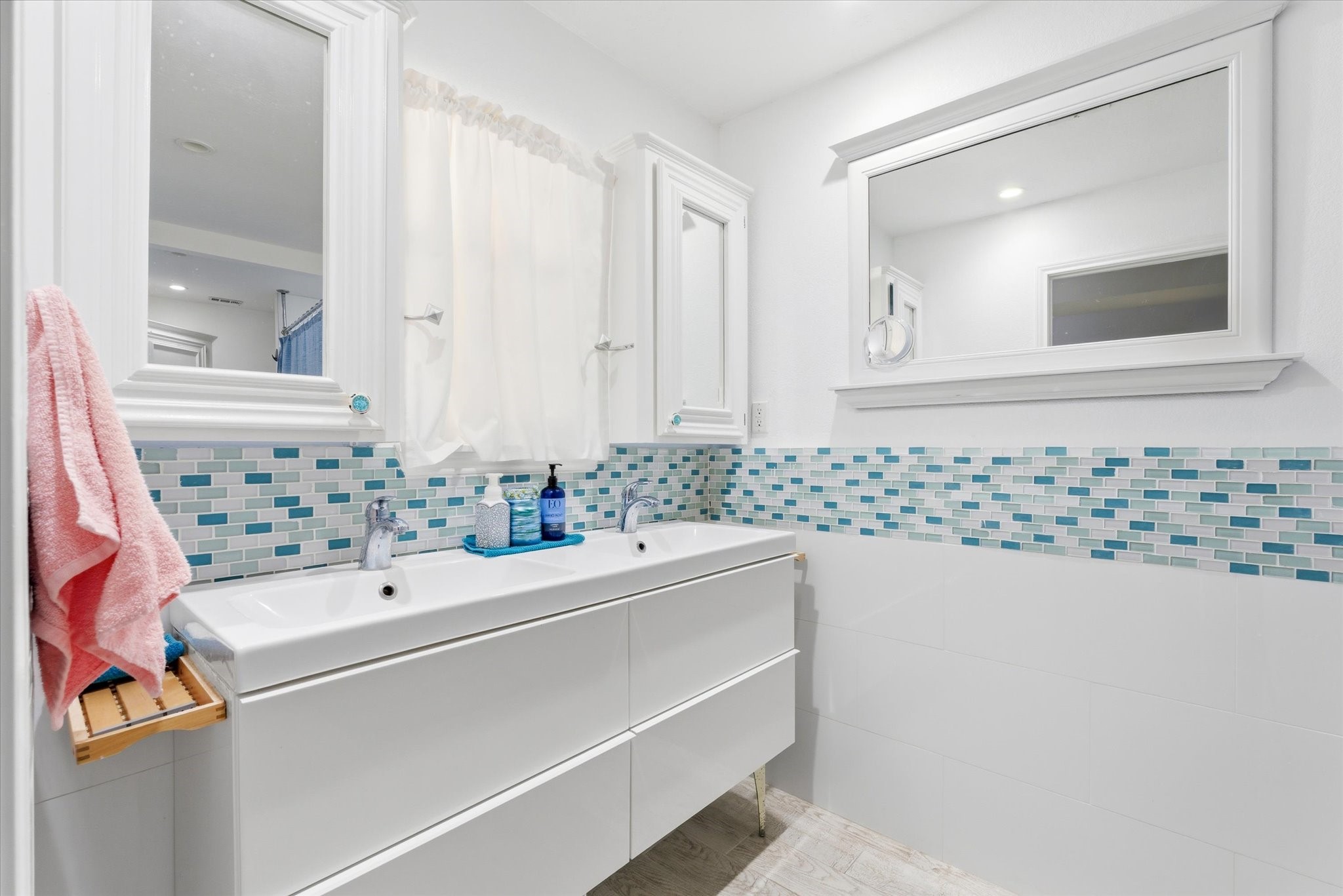 205 Don Q Baytown, TX 77523 - Photo 6 of 27 a bathroom with a sink and a mirror with bathtub