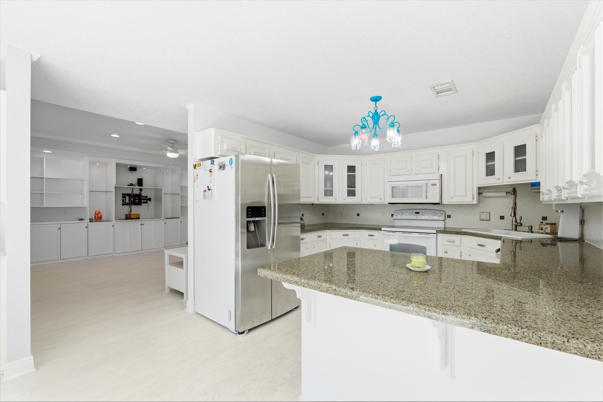 205 Don Q Baytown, TX 77523 - Photo 10 of 27 a kitchen with stainless steel appliances granite countertop a refrigerator a stove and a sink