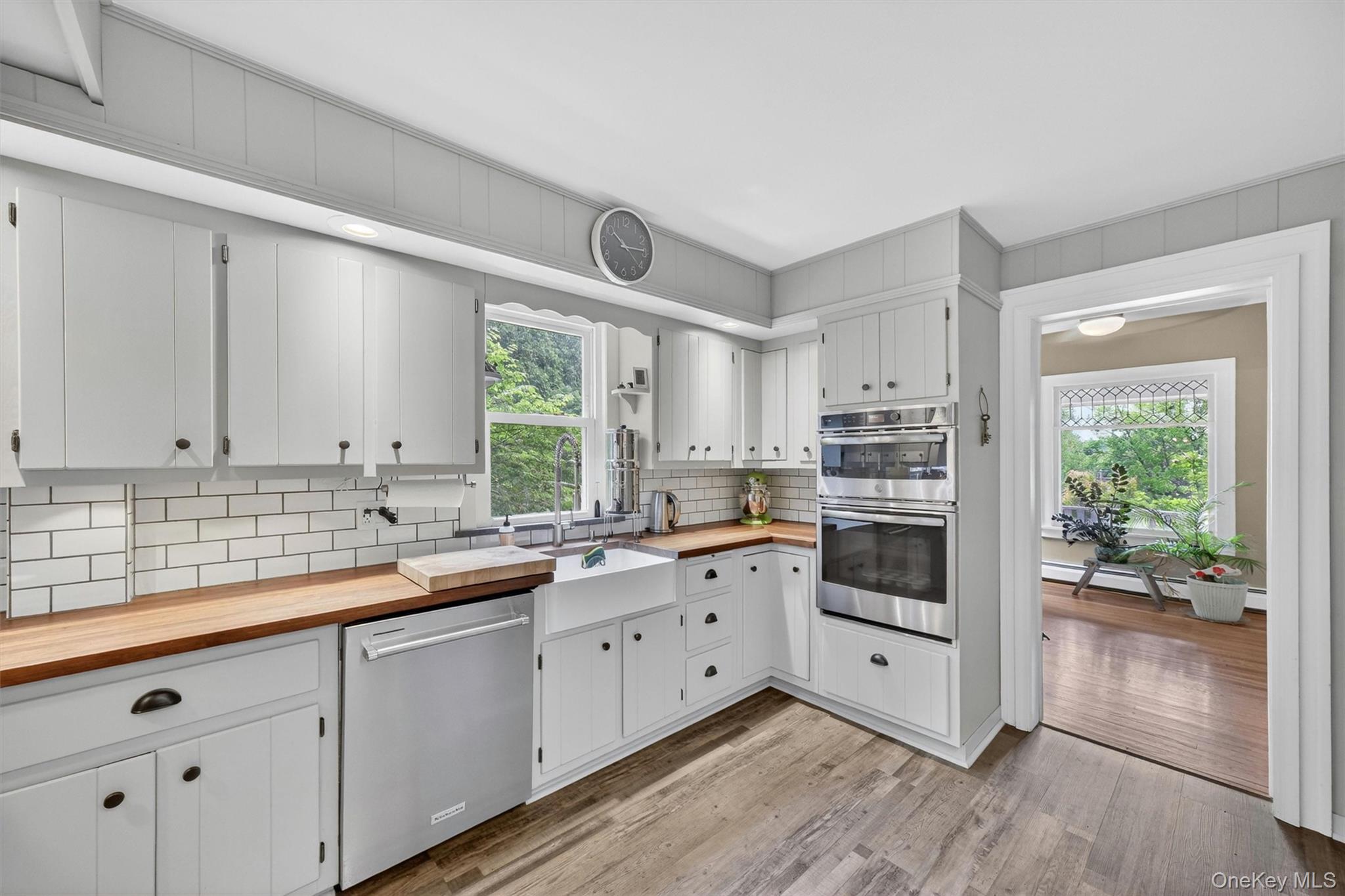 10 Edwin Road Poughkeepsie, NY 12603 - Photo 15 of 46 a kitchen with white cabinets white appliances and sink