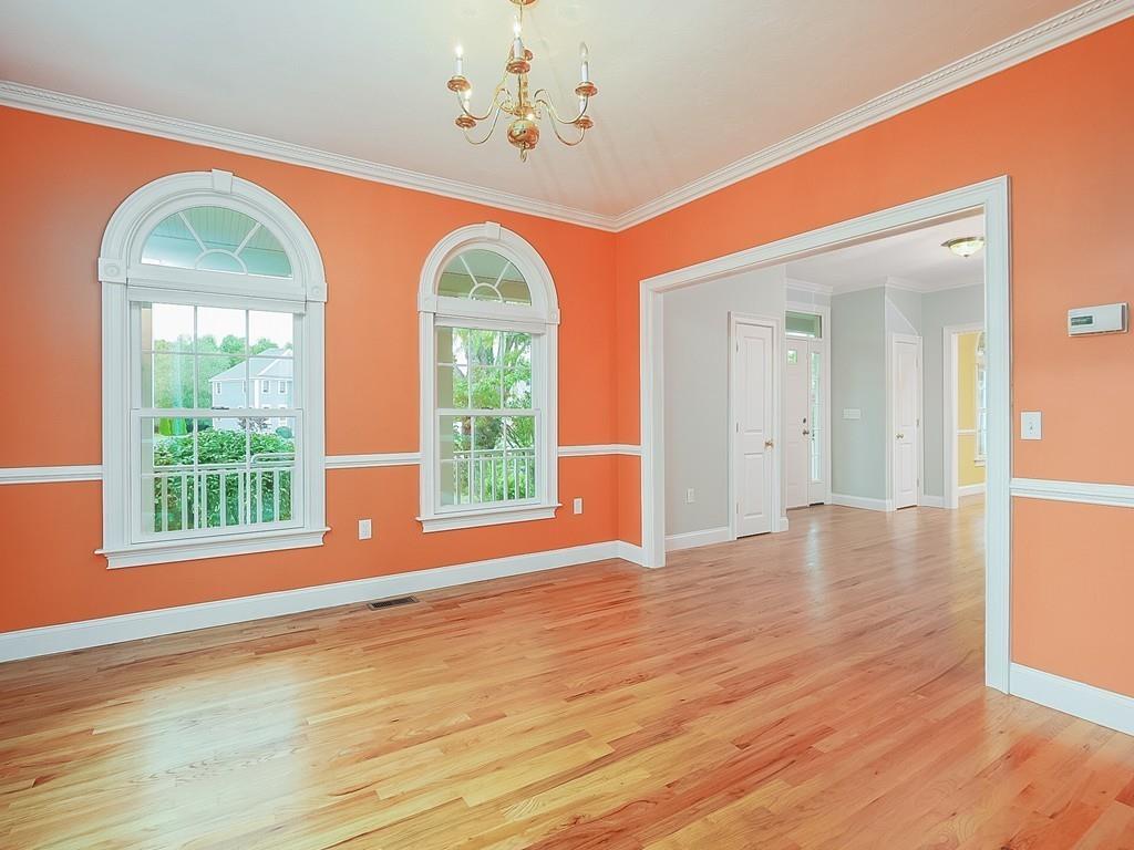 24 Village Road Pepperell, MA 01463 - Photo 14 of 40 a view of an empty room with wooden floor and a window