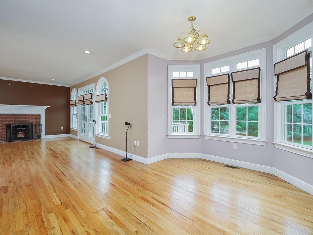 24 Village Road Pepperell, MA 01463 - Photo 15 of 40 a view of empty room with wooden floor and fireplace