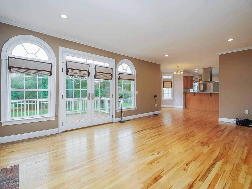 24 Village Road Pepperell, MA 01463 - Photo 18 of 40 a view of empty room with wooden floor and fan