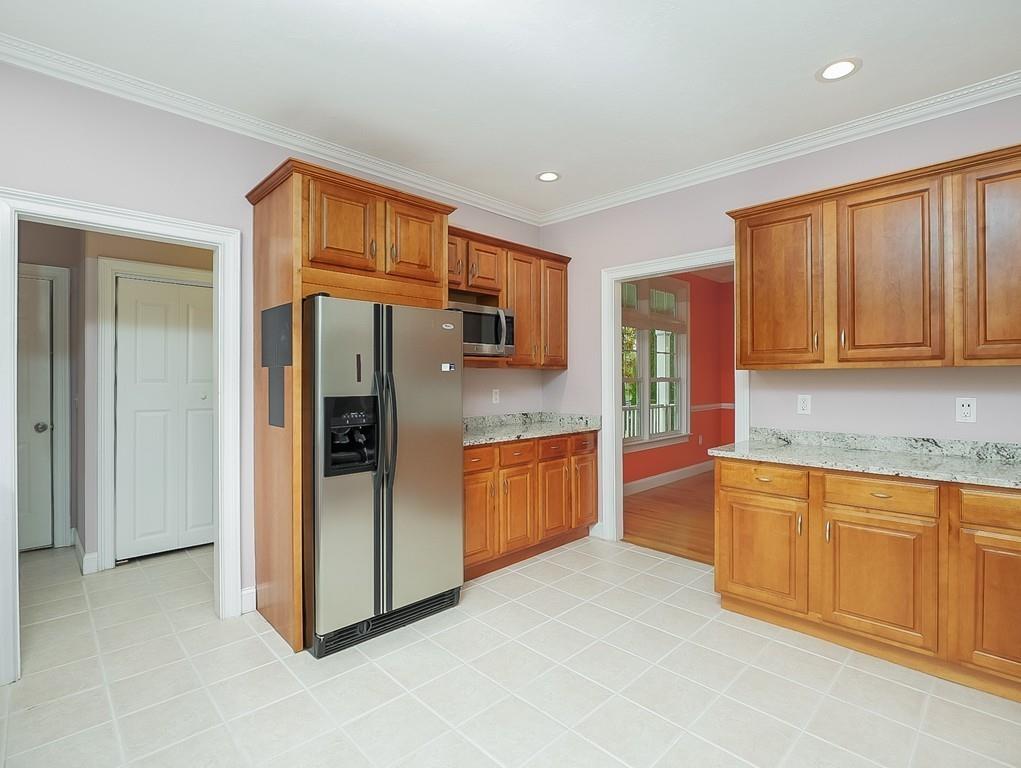 24 Village Road Pepperell, MA 01463 - Photo 23 of 40 a large kitchen with stainless steel appliances granite countertop a refrigerator and a sink