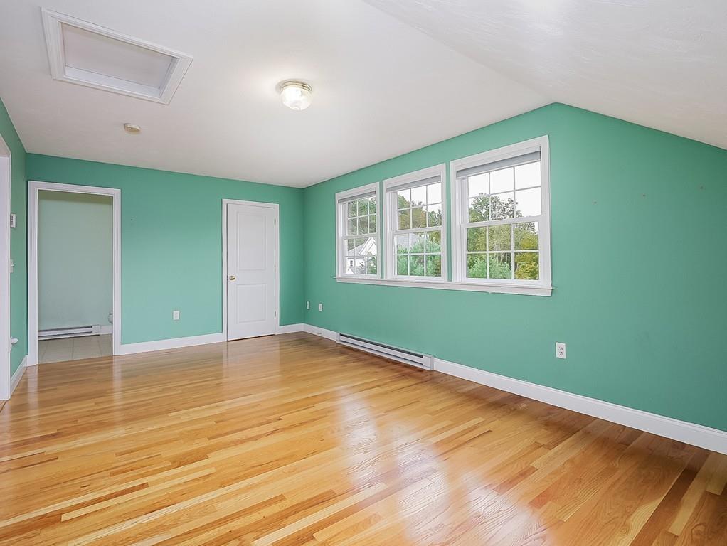 24 Village Road Pepperell, MA 01463 - Photo 28 of 40 a view of empty room with wooden floor and fan