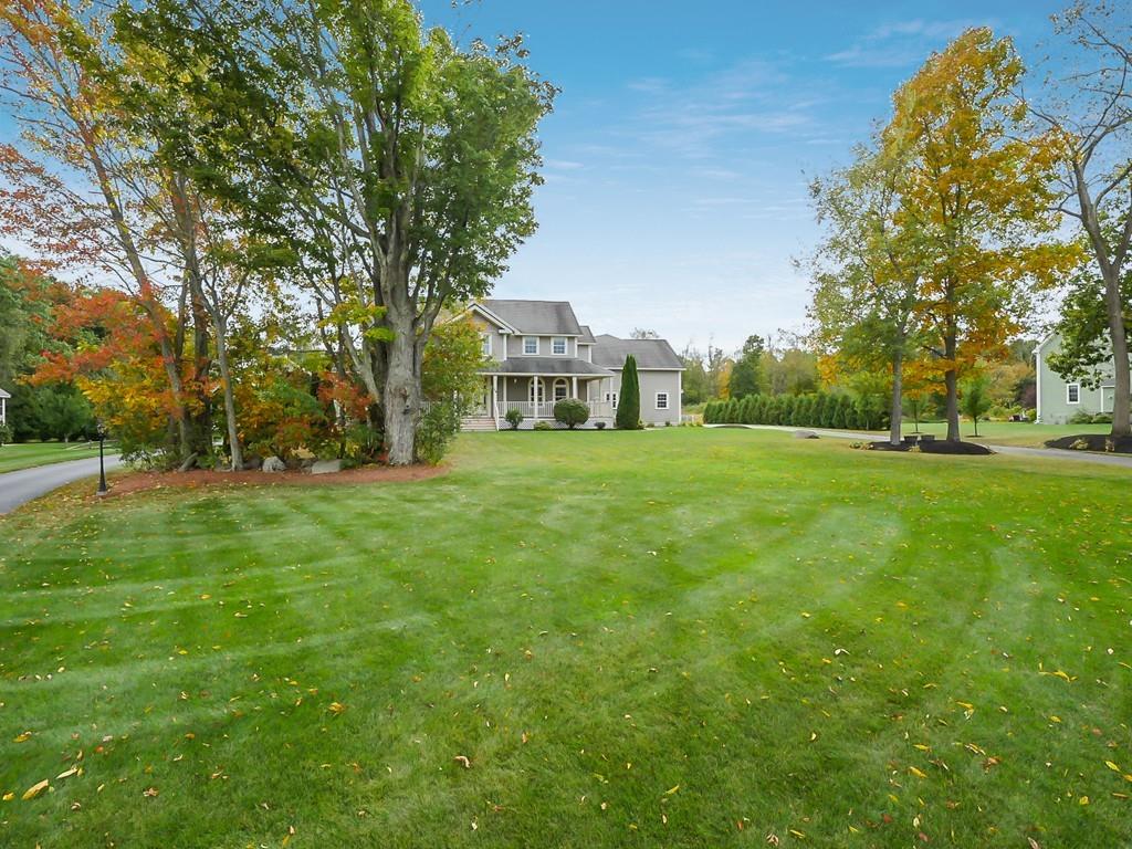 24 Village Road Pepperell, MA 01463 - Photo 3 of 40 a view of a trees with a big yard