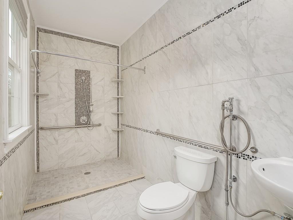 24 Village Road Pepperell, MA 01463 - Photo 40 of 40 a bathroom with a toilet and shower