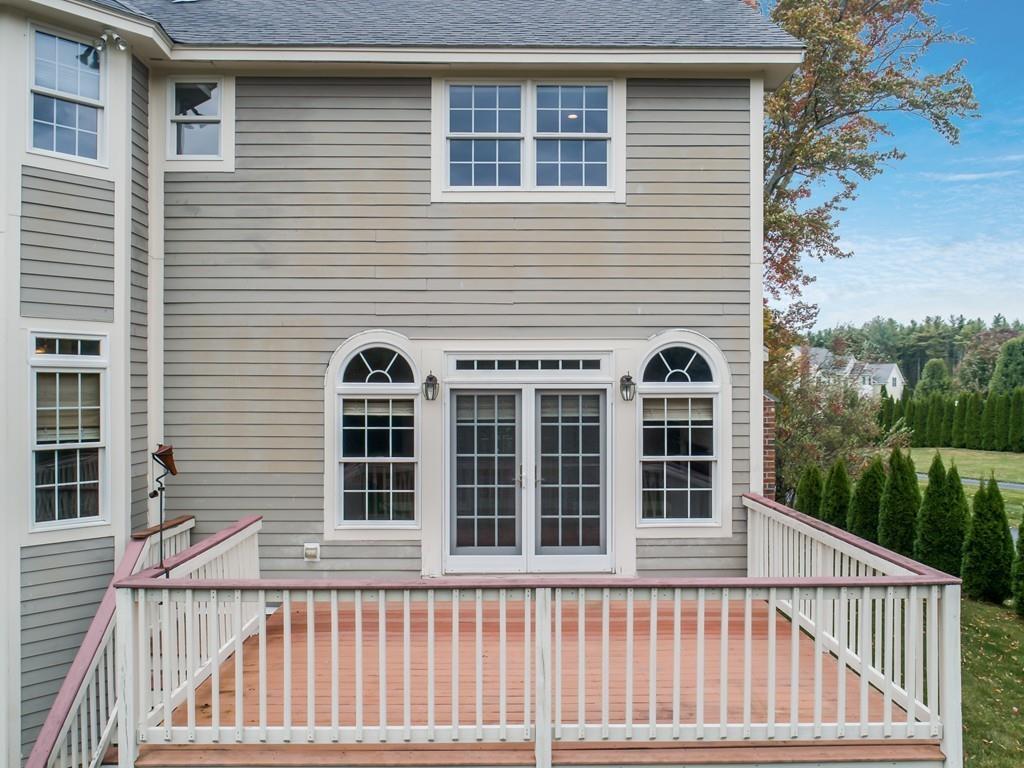 24 Village Road Pepperell, MA 01463 - Photo 6 of 40 a view of a balcony and a window