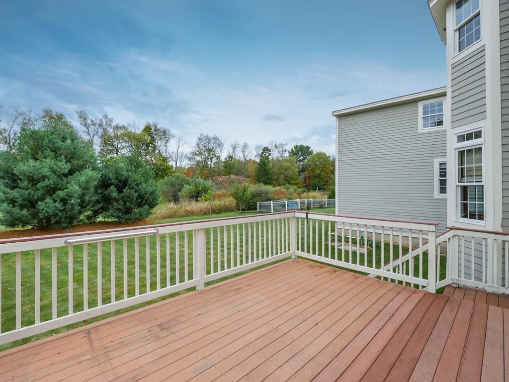 24 Village Road Pepperell, MA 01463 - Photo 7 of 40 a view of a wooden roof deck