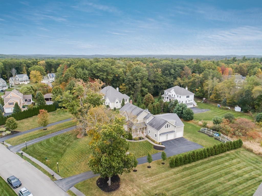 24 Village Road Pepperell, MA 01463 - Photo 8 of 40 an aerial view of a house with a yard
