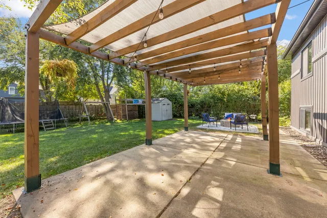 a view of yard with patio