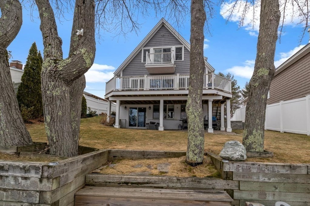 20 Bates Point Road Webster, MA 01570 - Photo 1 of 32 a front view of a house with garden