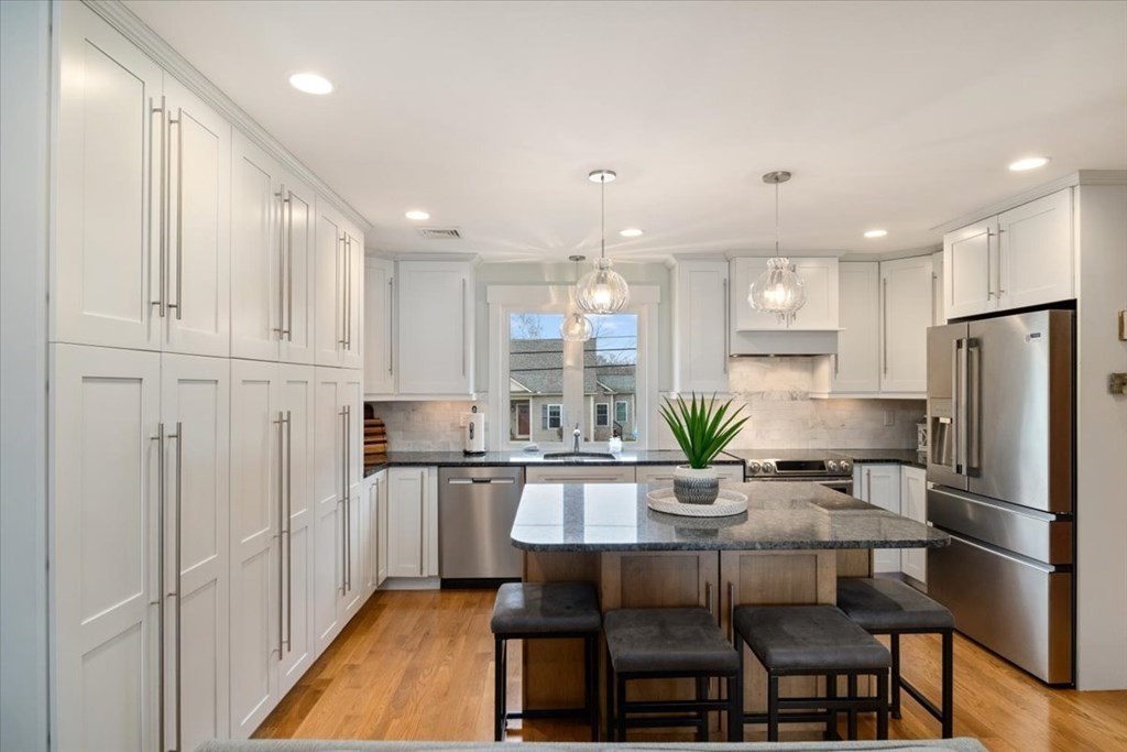 20 Bates Point Road Webster, MA 01570 - Photo 13 of 32 a kitchen with refrigerator and cabinets