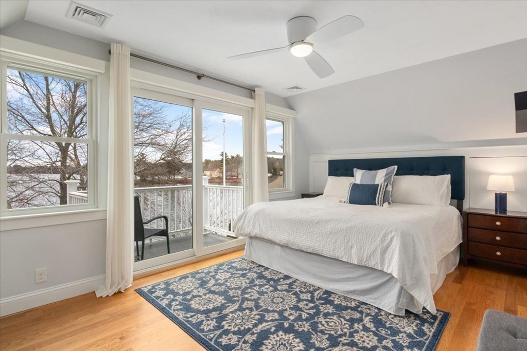 20 Bates Point Road Webster, MA 01570 - Photo 15 of 32 a bedroom with a large bed and a window