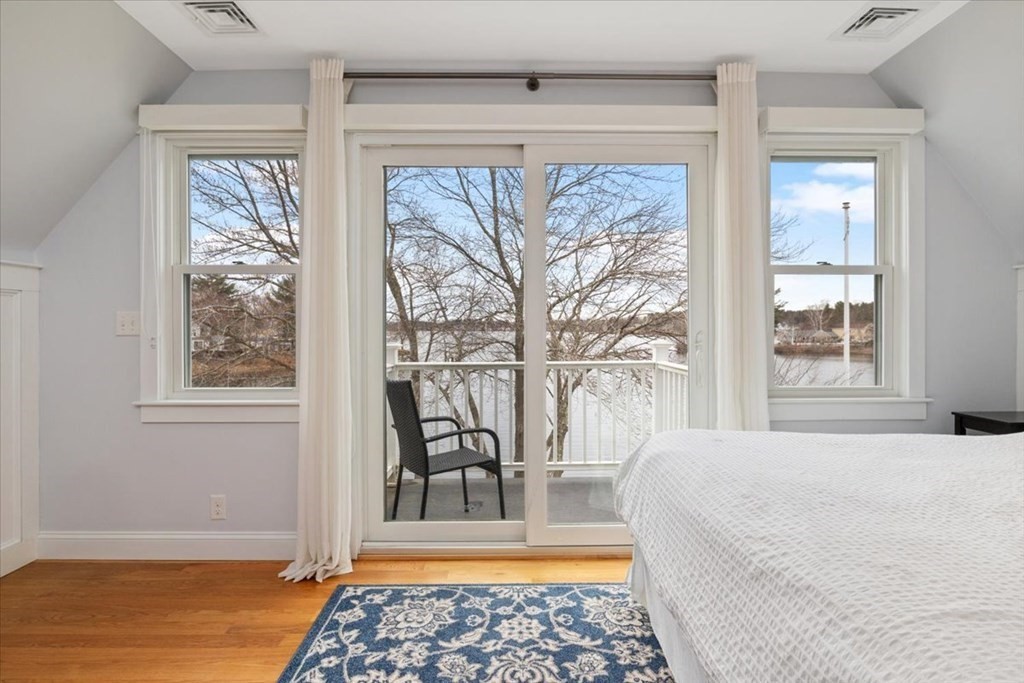 20 Bates Point Road Webster, MA 01570 - Photo 16 of 32 a bedroom with a large window and a table