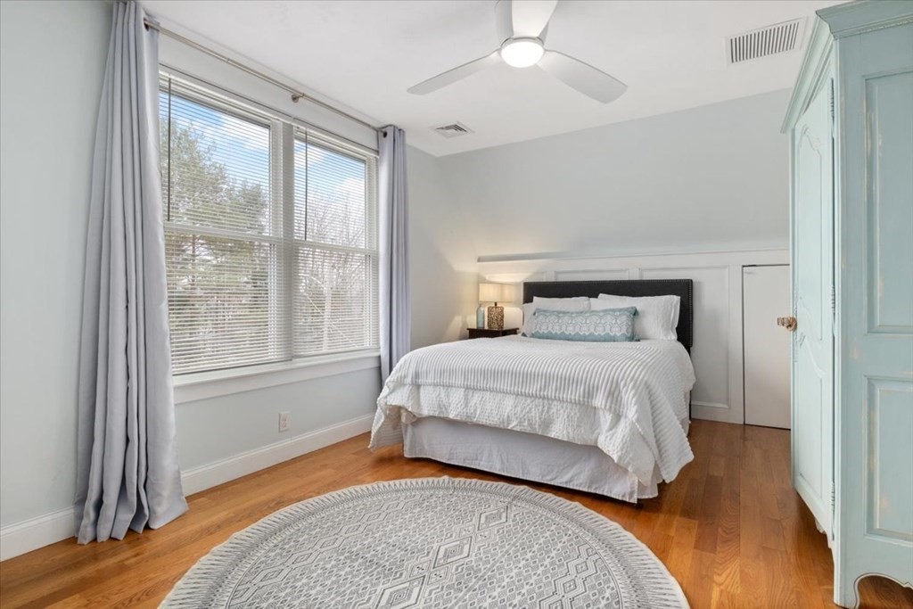 20 Bates Point Road Webster, MA 01570 - Photo 18 of 32 a bedroom with a large bed and a large window