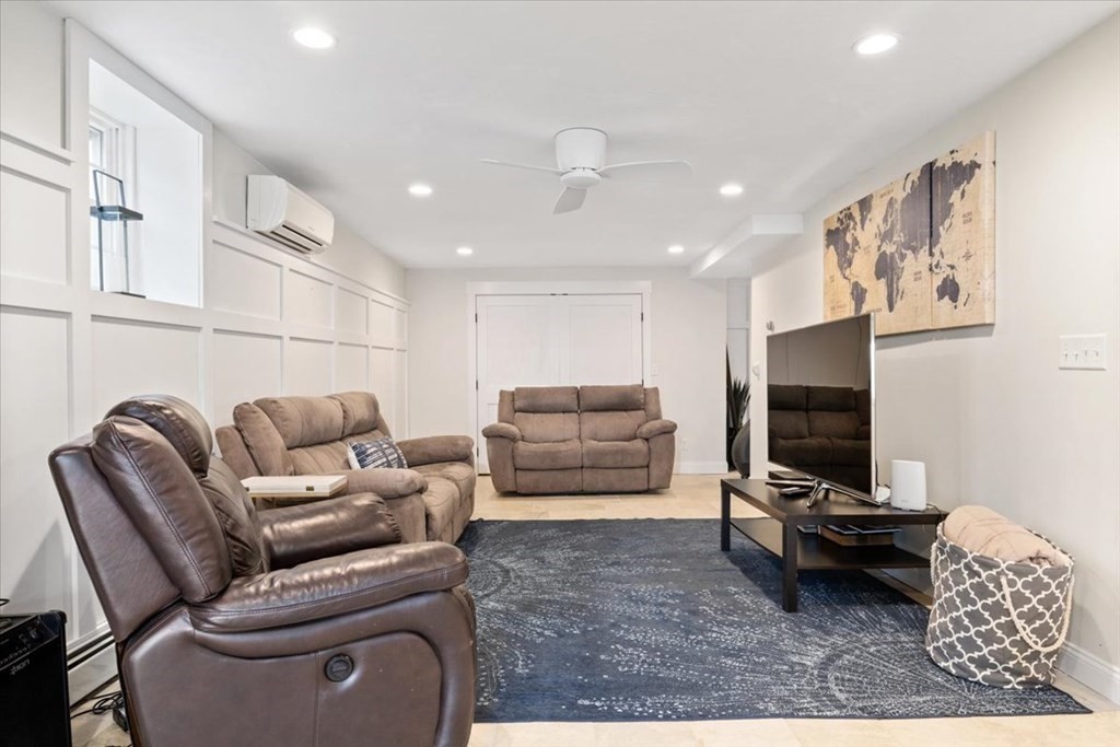 20 Bates Point Road Webster, MA 01570 - Photo 20 of 32 a living room with furniture and a flat screen tv