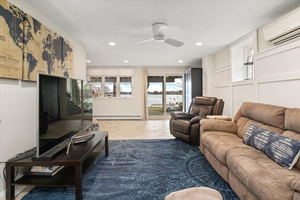 20 Bates Point Road Webster, MA 01570 - Photo 21 of 32 a living room with furniture and a window